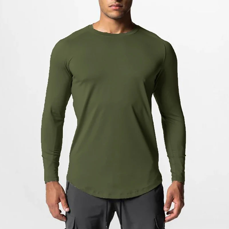 Camiseta Masculina Fitness de manga longa com tecnologia de secagem rápida que mantém seu corpo seco durante os treinos mais intensos. O tecido elástico proporciona liberdade total de movimentos enquanto você se exercita, adaptando-se perfeitamente ao seu corpo. Ideal para academia, corridas ou qualquer atividade física, esta blusa combina conforto, durabilidade e estilo para elevar seu desempenho ao máximo.